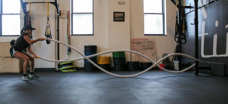 woman holding exercise using training rope